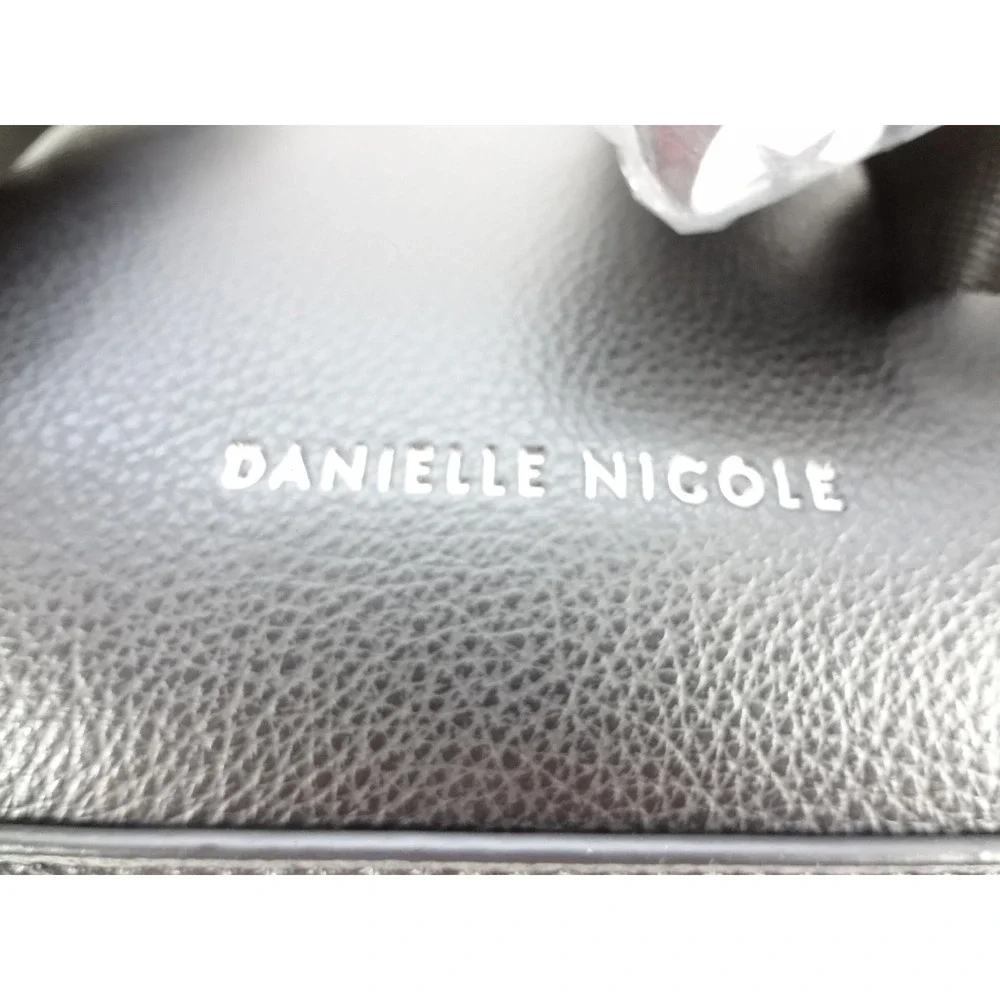 Danielle Nicole Disney Cruella Mini Backpack Black White NEW Pom Pom